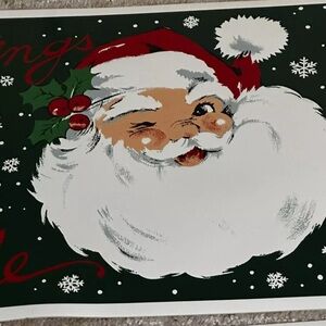Vtg vinyl Christmas mats. Winking Santa, northpole greetings. Tiny rip on one.